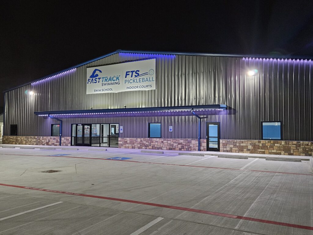 Picture of the Fast Track building at night.